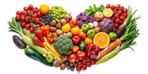 Assorted fruits and vegetables arranged in the shape of a heart